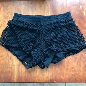 Black Popflex athletic shorts with cute netting design and pockets